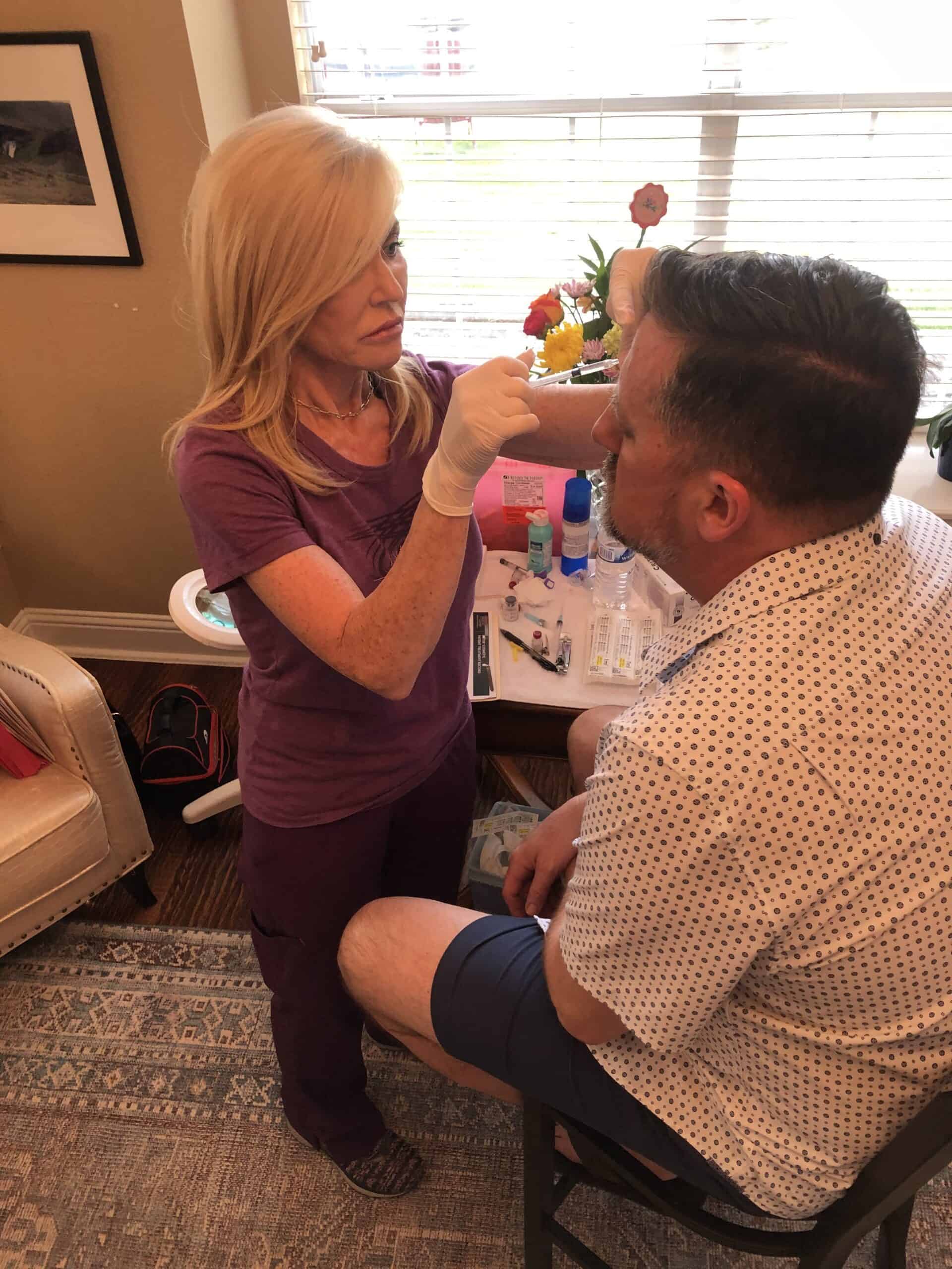 Lisa Rux is giving a Botox injection to a customer