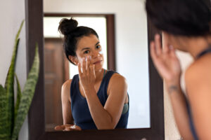 Applying sunscreen to face