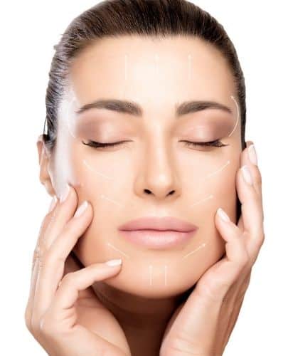 Woman touching her face after a botox treatment